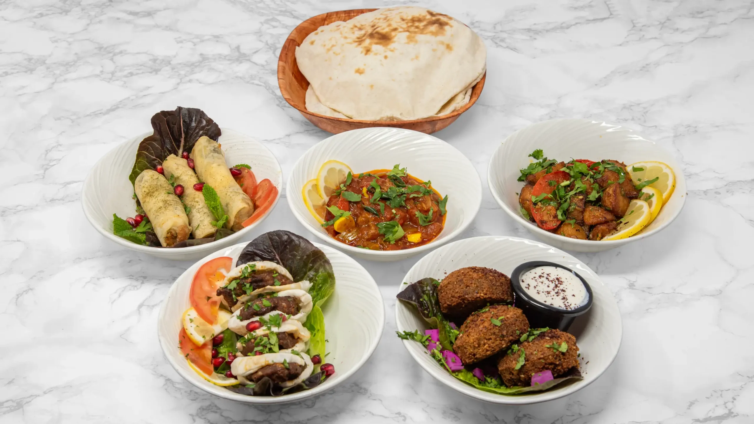 Syrian sharing food for Christmas group dining at Damastique York