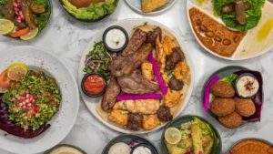 Middle Eastern grilled meats, falafel, tabbouleh and mezze dishes served together